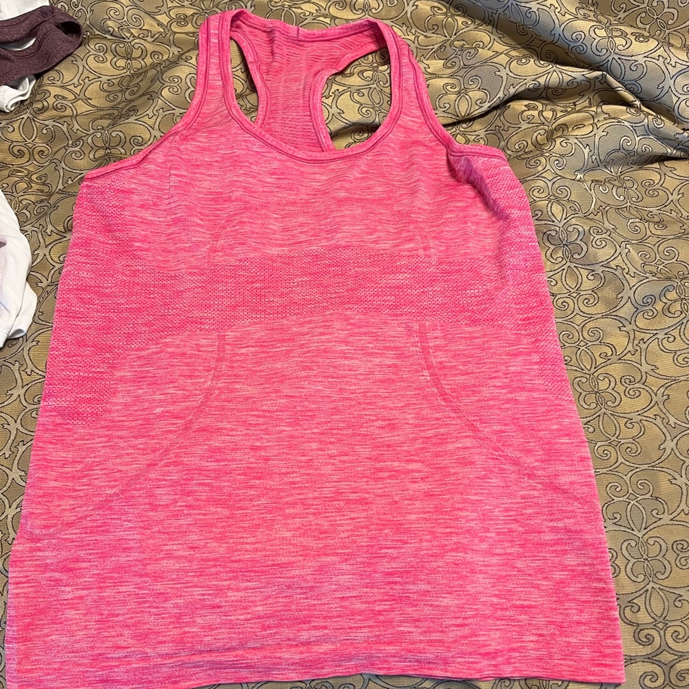 Bright pink lululemon swiftly tank